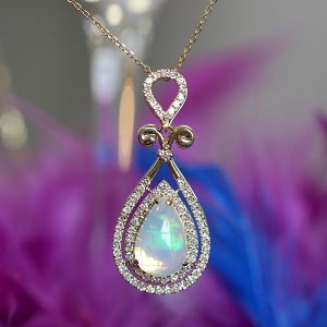 tear drop shaped fancy opal pendant with double halo