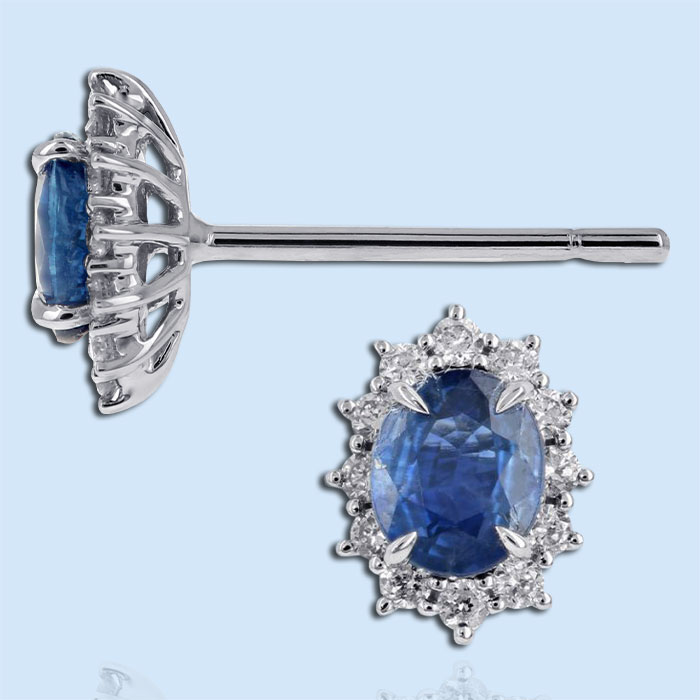 blue sapphire oval stud earrings with a diamond halo